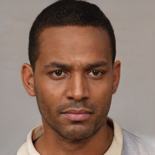 Neutral latino young-adult male with short  brown hair and brown eyes