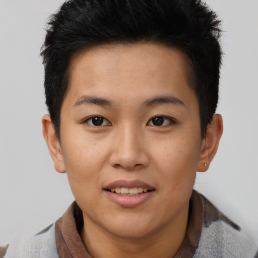Joyful asian young-adult female with short  brown hair and brown eyes