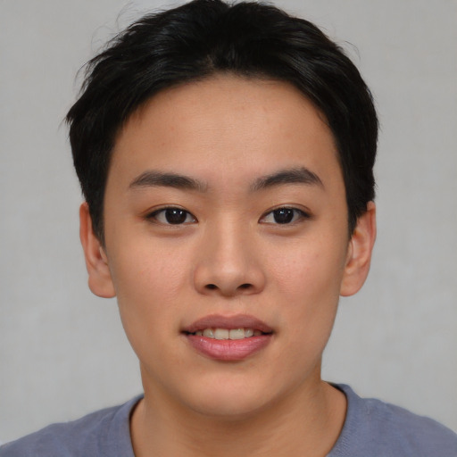Joyful asian young-adult female with short  black hair and brown eyes