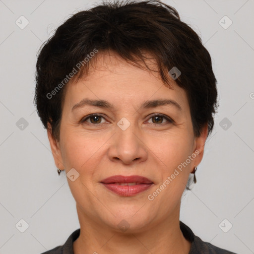 Joyful white adult female with short  brown hair and brown eyes