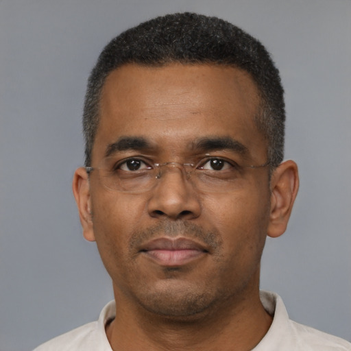 Neutral latino adult male with short  black hair and brown eyes