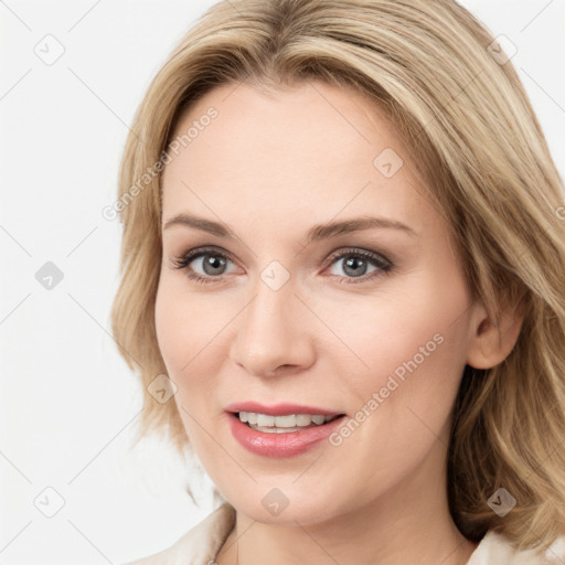 Joyful white young-adult female with medium  brown hair and blue eyes