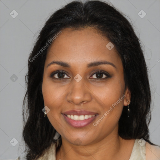Joyful black young-adult female with long  brown hair and brown eyes