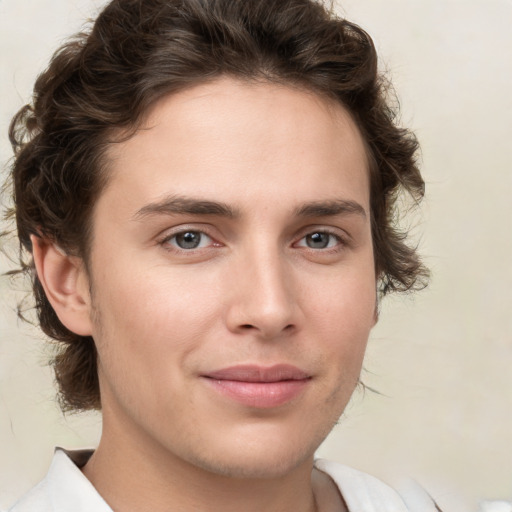 Joyful white young-adult male with medium  brown hair and brown eyes