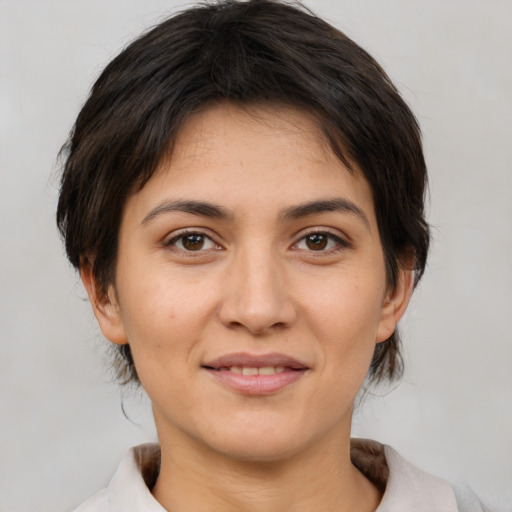 Joyful white young-adult female with medium  brown hair and brown eyes