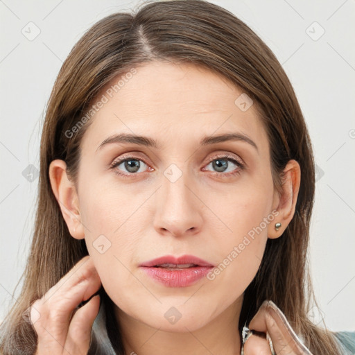 Neutral white young-adult female with long  brown hair and grey eyes