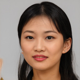 Joyful asian young-adult female with long  brown hair and brown eyes