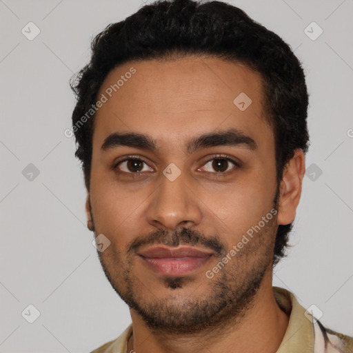 Joyful latino young-adult male with short  black hair and brown eyes