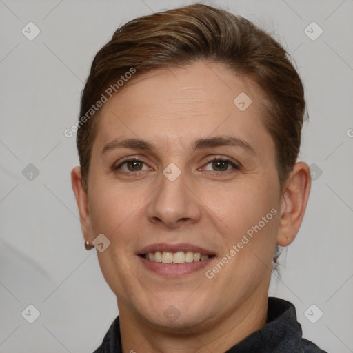 Joyful white adult female with short  brown hair and brown eyes