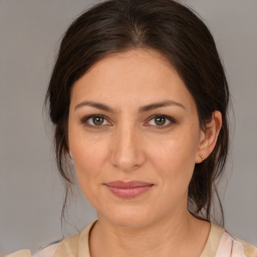 Joyful white young-adult female with medium  brown hair and brown eyes