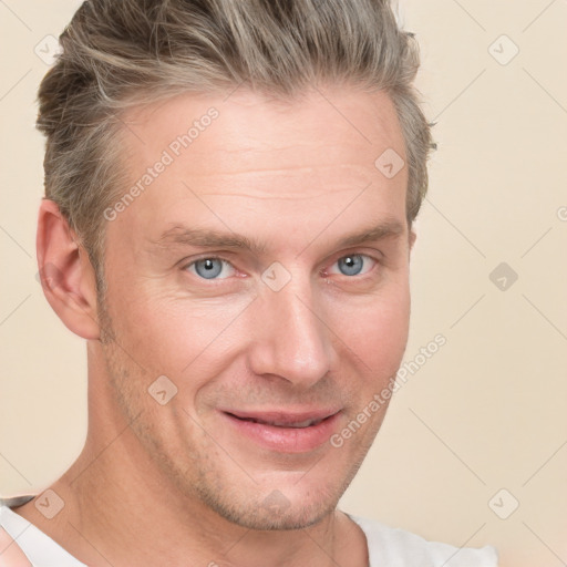 Joyful white adult male with short  brown hair and grey eyes