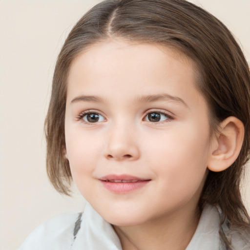 Joyful white child female with medium  brown hair and brown eyes