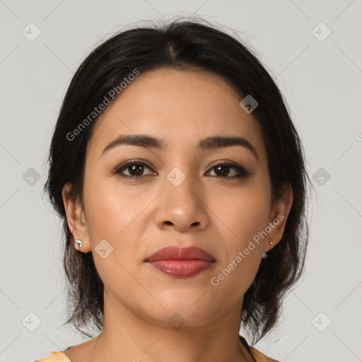 Joyful latino young-adult female with medium  brown hair and brown eyes