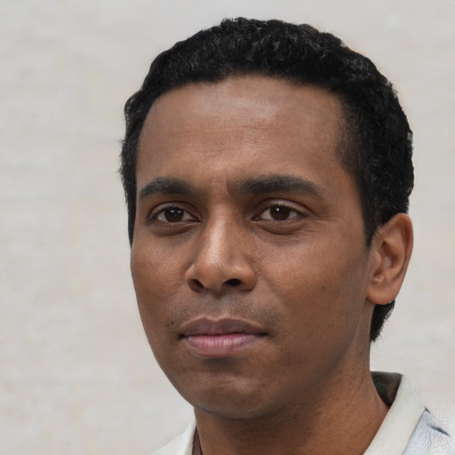 Neutral black young-adult male with short  black hair and brown eyes