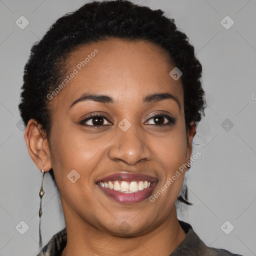 Joyful black young-adult female with short  brown hair and brown eyes