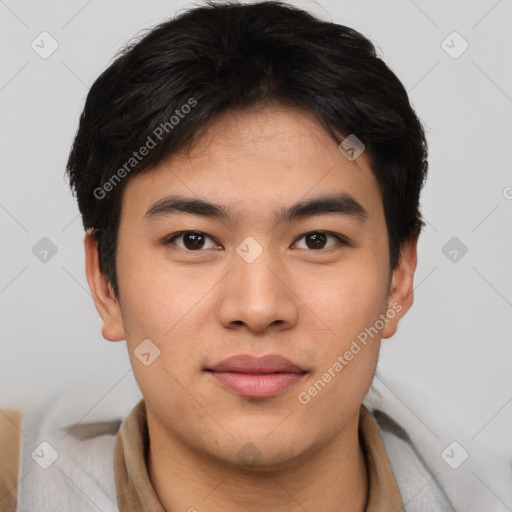 Joyful asian young-adult male with short  brown hair and brown eyes