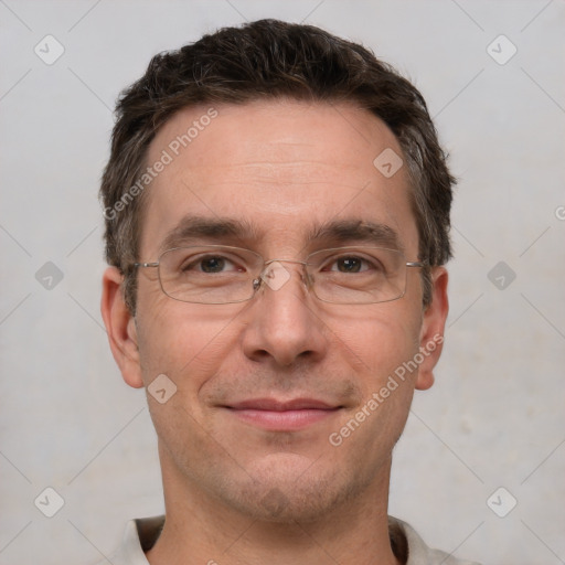 Joyful white adult male with short  brown hair and grey eyes