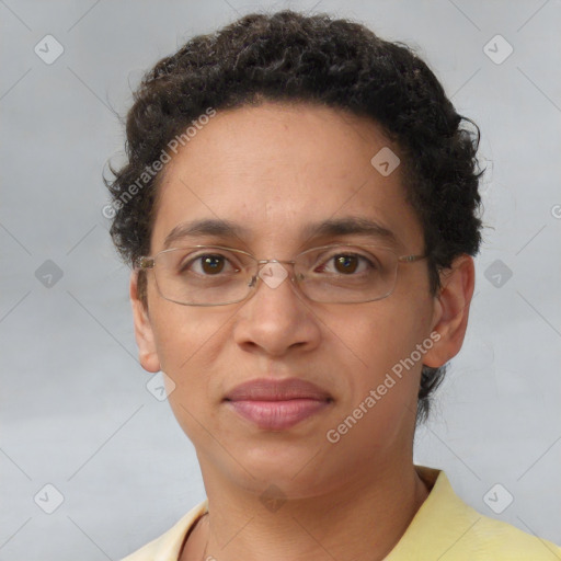 Joyful black adult female with short  brown hair and brown eyes