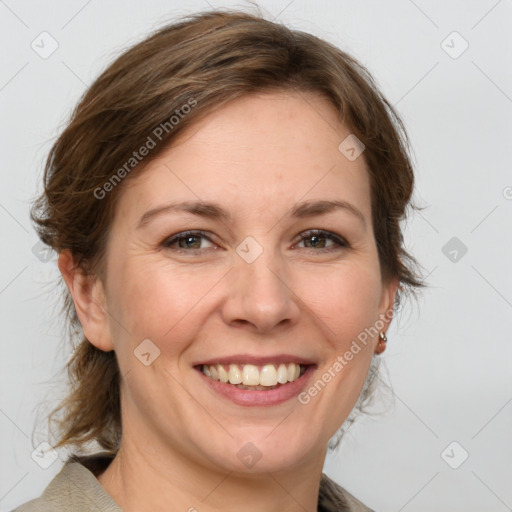 Joyful white adult female with medium  brown hair and grey eyes