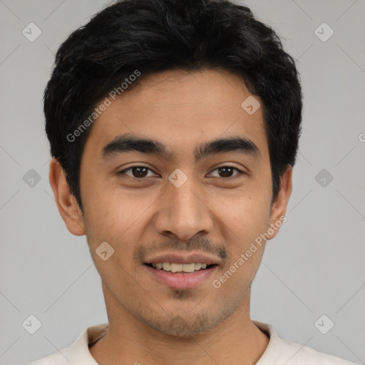 Joyful latino young-adult male with short  black hair and brown eyes