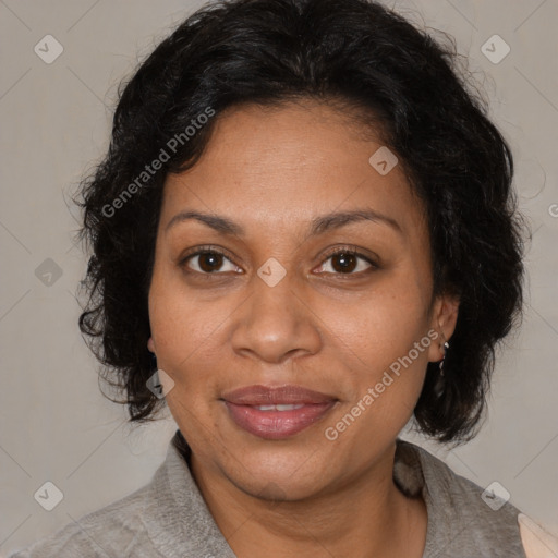 Joyful black adult female with medium  brown hair and brown eyes