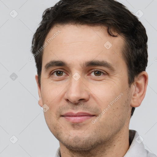 Joyful white young-adult male with short  brown hair and brown eyes