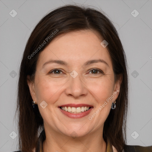 Joyful white adult female with medium  brown hair and brown eyes