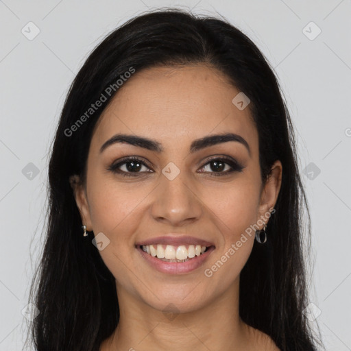 Joyful latino young-adult female with long  brown hair and brown eyes