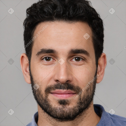 Joyful white young-adult male with short  black hair and brown eyes