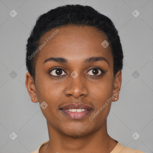 Joyful black young-adult female with short  black hair and brown eyes