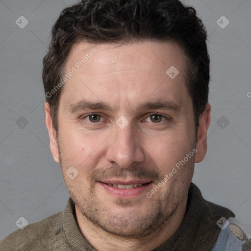 Joyful white adult male with short  brown hair and grey eyes