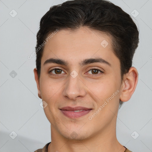 Joyful white young-adult male with short  brown hair and brown eyes