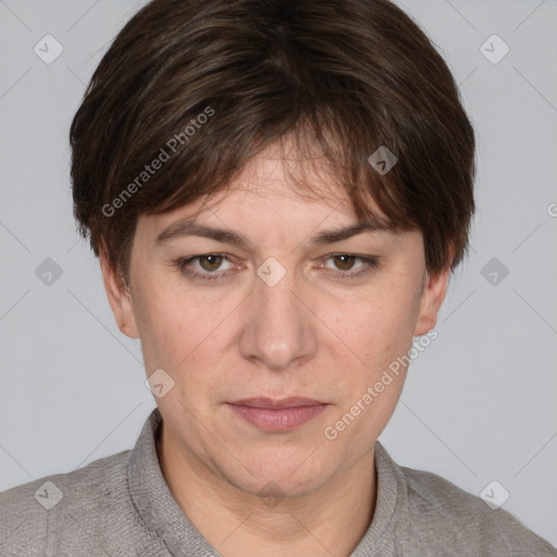 Joyful white adult female with short  brown hair and grey eyes