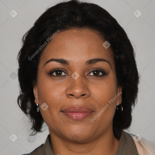 Joyful black adult female with medium  brown hair and brown eyes