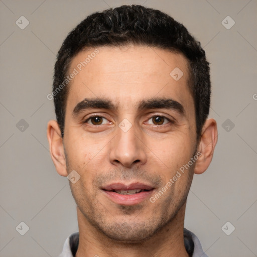 Joyful white young-adult male with short  black hair and brown eyes