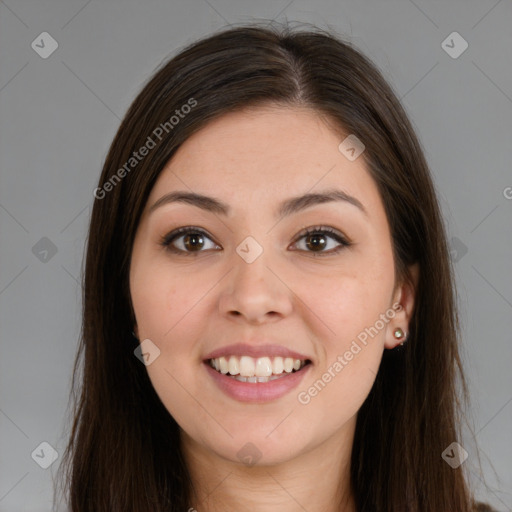 Joyful latino young-adult female with long  brown hair and brown eyes