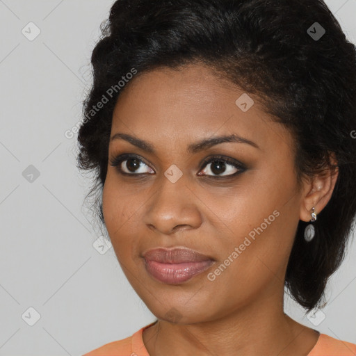 Joyful black young-adult female with long  brown hair and brown eyes