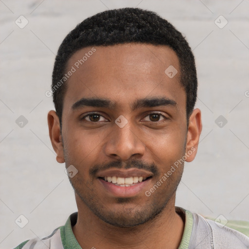 Joyful black young-adult male with short  black hair and brown eyes