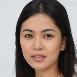 Joyful asian young-adult female with long  brown hair and brown eyes