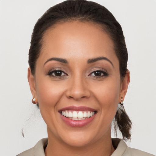 Joyful white young-adult female with medium  brown hair and brown eyes