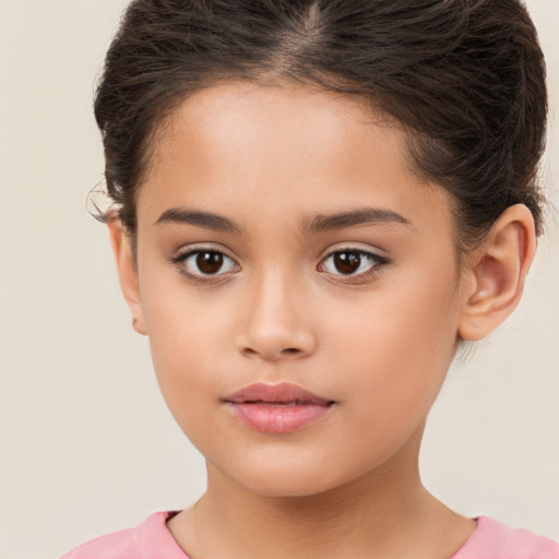 Joyful white child female with short  brown hair and brown eyes