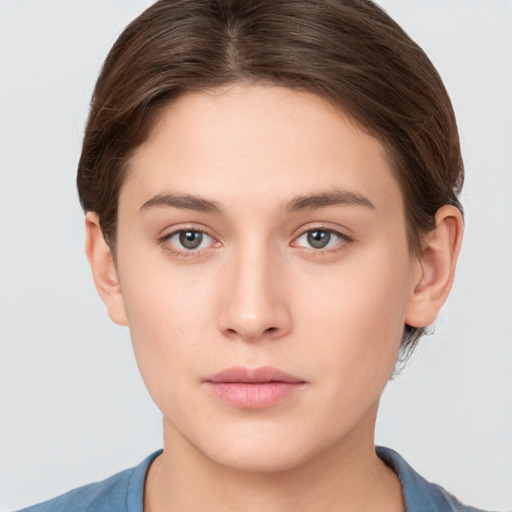 Neutral white young-adult female with short  brown hair and brown eyes