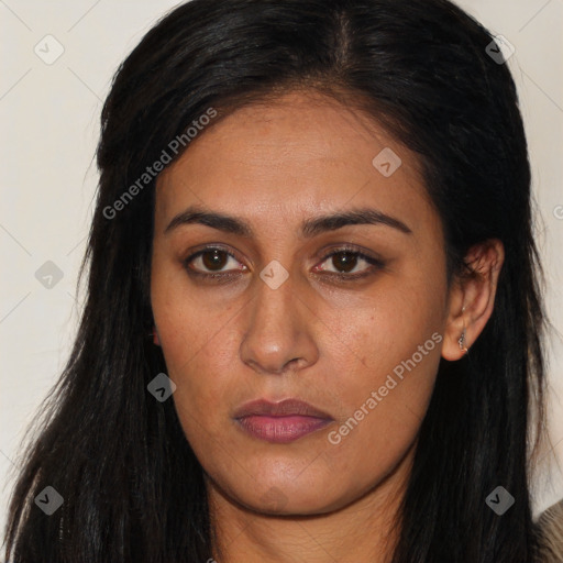 Joyful latino young-adult female with long  brown hair and brown eyes