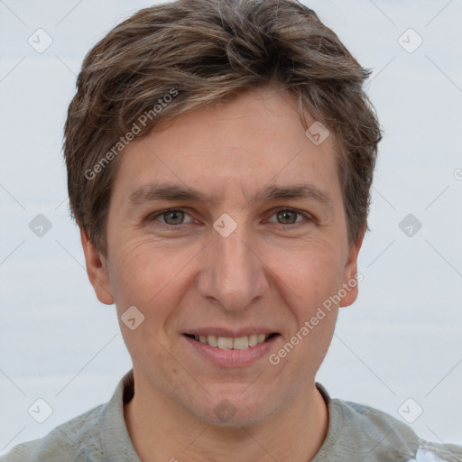 Joyful white adult male with short  brown hair and grey eyes