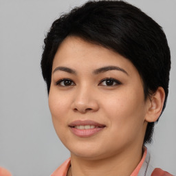 Joyful asian young-adult female with short  black hair and brown eyes