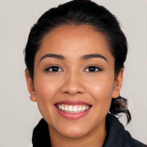 Joyful latino young-adult female with medium  black hair and brown eyes