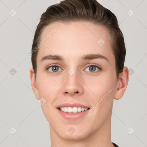 Joyful white young-adult female with short  brown hair and grey eyes