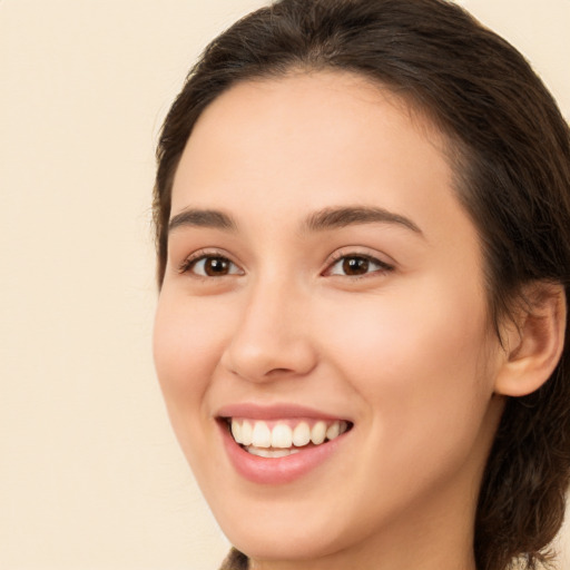 Joyful white young-adult female with medium  brown hair and brown eyes