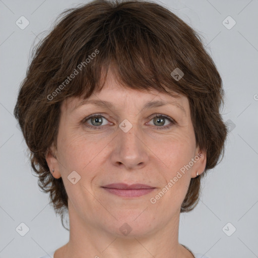 Joyful white adult female with medium  brown hair and grey eyes