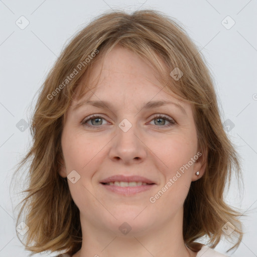 Joyful white young-adult female with medium  brown hair and blue eyes